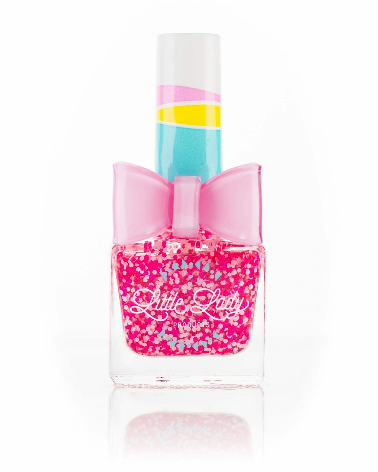 Princess Kisses pink nail polish bottle with an adorable bow, designed for kids, offering a berry scent and fun, safe, stylish mini-manicure experience.
