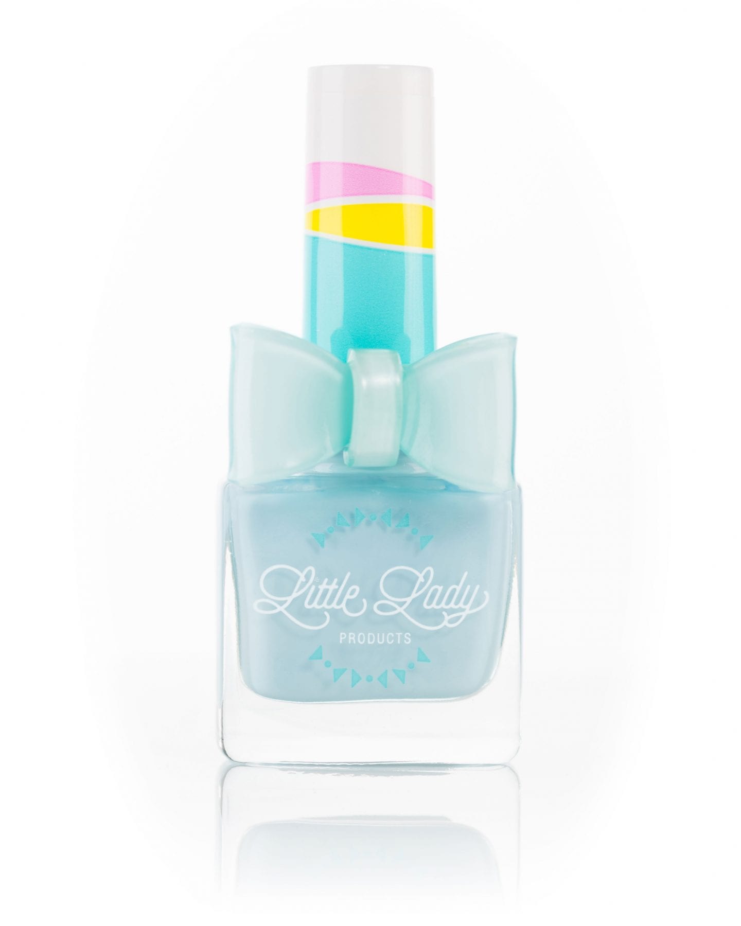 Tropical Tango nail polish bottle, designed for kids, with a logo close-up, embodying fun and safety from Little Lady Products.