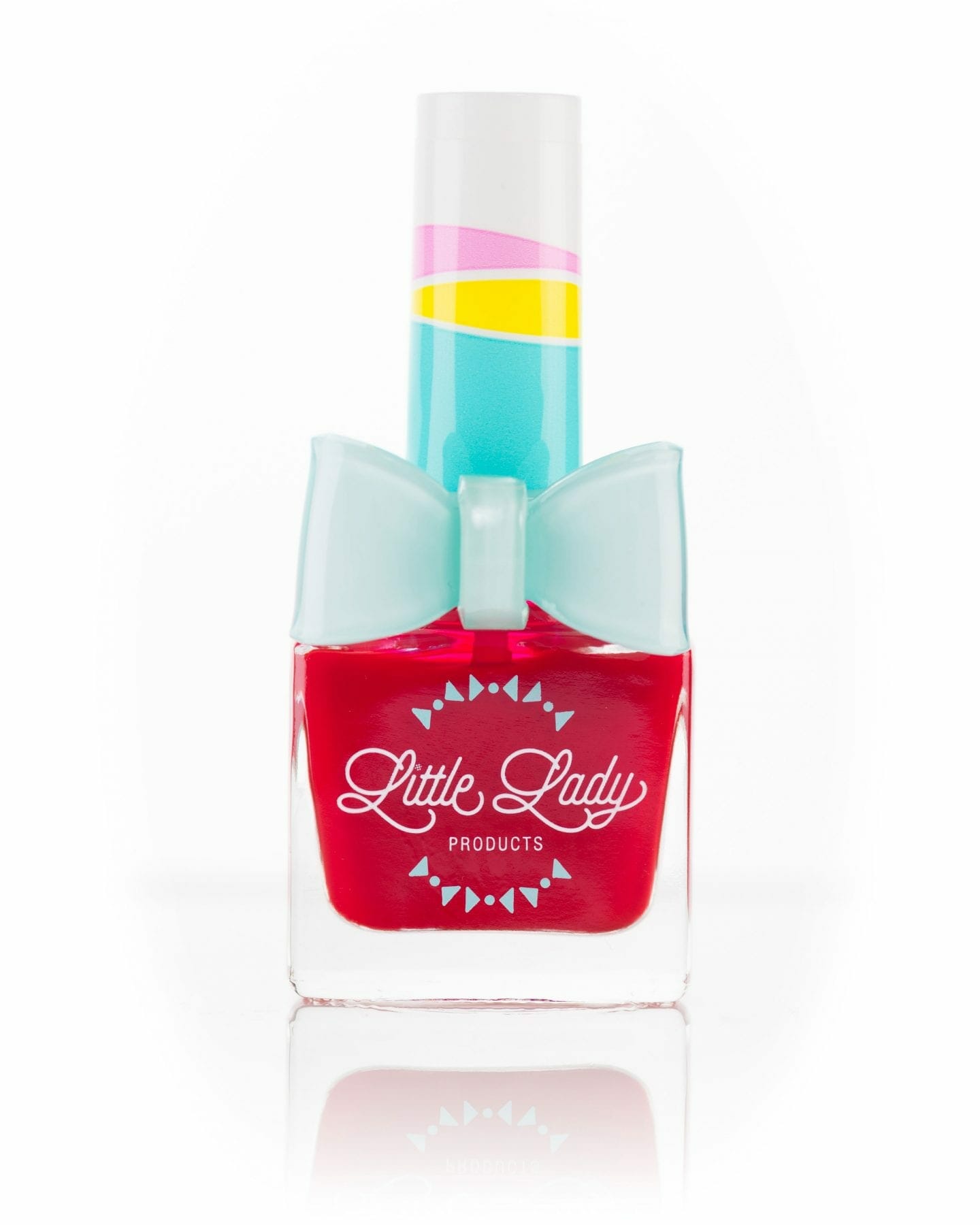 So Very Strawberry nail polish bottle with a bow ring, offering a fun, safe, and stylish manicure experience for kids, designed by Little Lady Products.