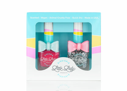 Fairy Duo set includes Fruit Fairy and Fairy Dust nail polishes, each in a box with a decorative pink bow, perfect for a magical mini-manicure experience.