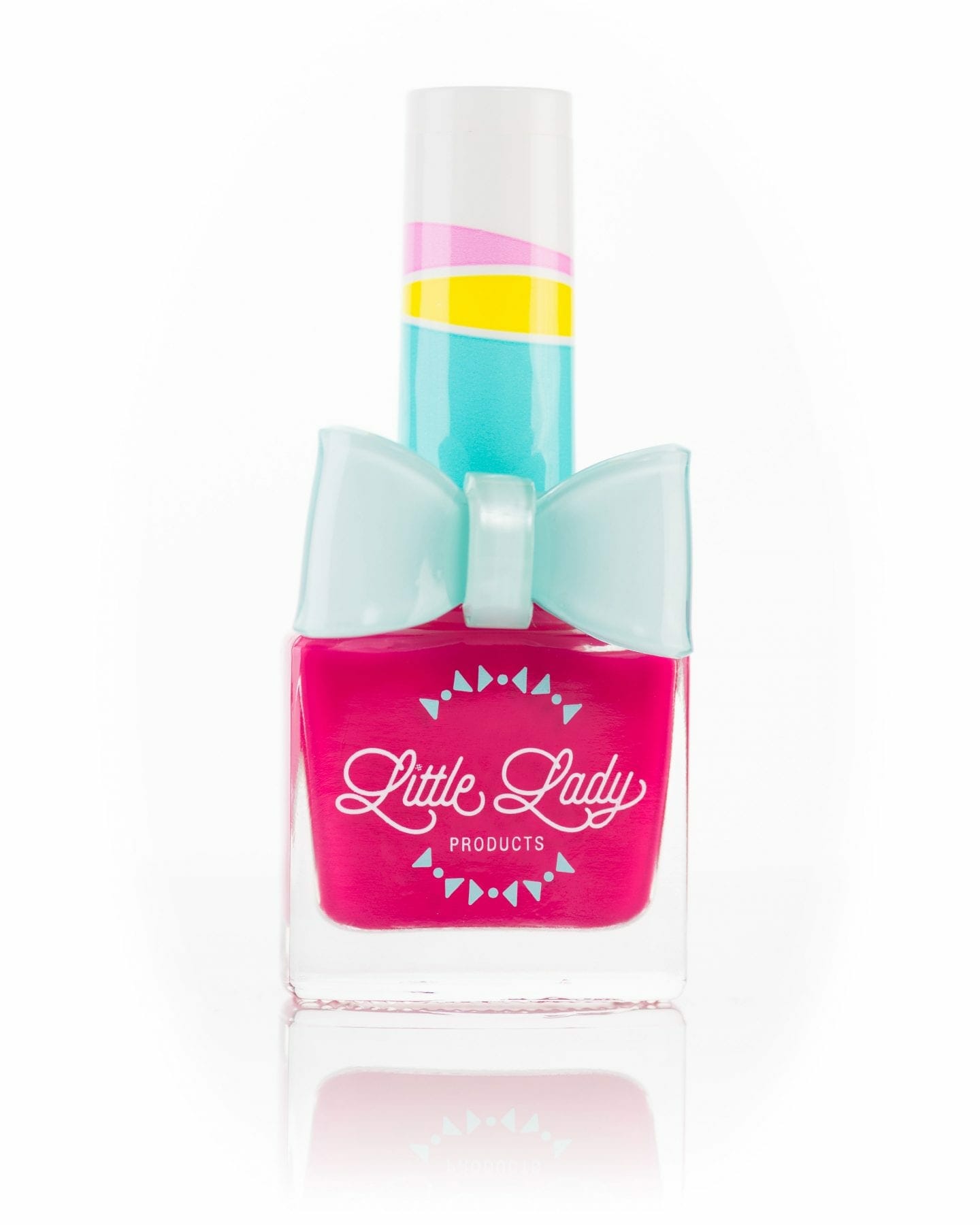 Fruit Fairy nail polish bottle adorned with a blue bow, designed for kids. Toxin-free and scented, perfect for creating magical, playful mini-manicures.